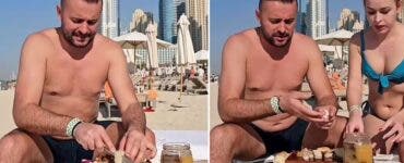 Doi români au mâncat slănină și ceapă pe o plajă din Dubai, sub privirile tuturor. Cum a fost perceput gestul lor